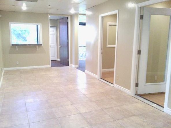 Ground floor office with beautiful tile entry and reception. Several uses.